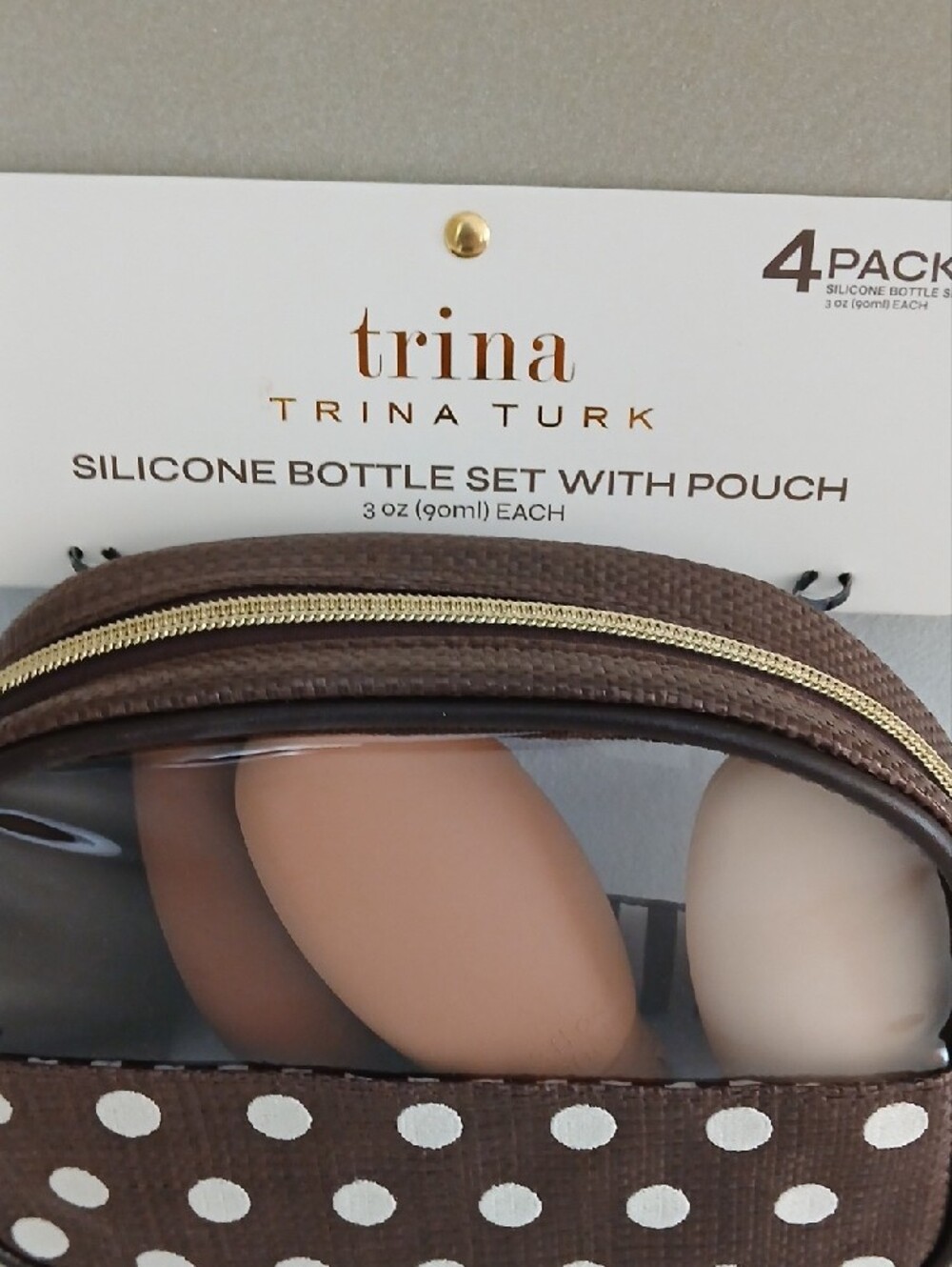 Trina Turk Brown Polka Dot Silicone Bottle Set with Clear-Window Pouch - Picture 2 of 3